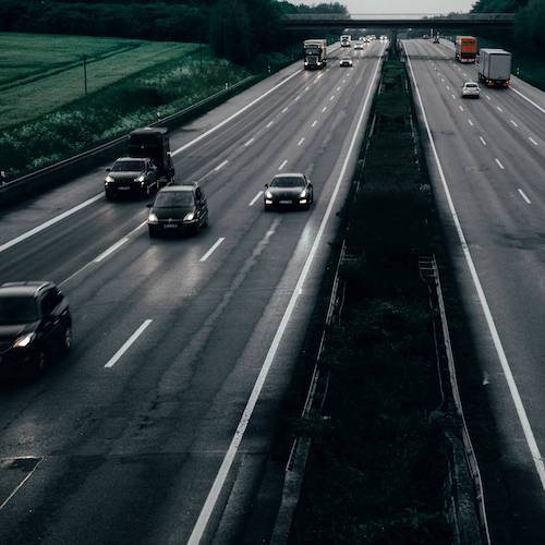 View of a motorway with a number of cars driving in different directions