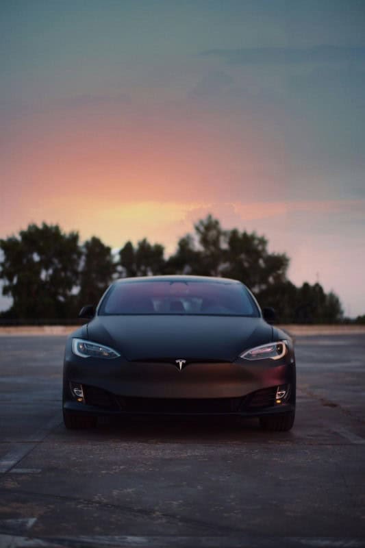 Image of a tesla at sunset