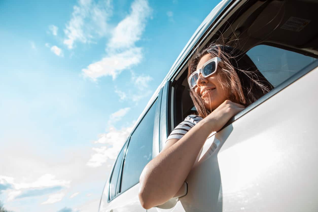 Woman looking out from car window