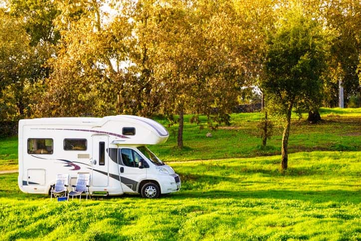 Camper and chairs on nature